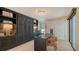Dedicated office space with custom built-ins, a sleek desk, and ample storage, ideal for remote work at 3151 Bayou Sound, Longboat Key, FL 34228