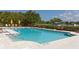 Swimming pool surrounded by lounge chairs and umbrellas, ideal for relaxation and recreation at 3151 Bayou Sound, Longboat Key, FL 34228