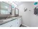 Elegant bathroom featuring double sinks and marble countertops at 3424 90Th N Ter, Pinellas Park, FL 33782