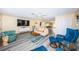 Spacious living room showcasing modern flooring, stylish decor, and an open layout, ideal for both relaxing and entertaining guests at 3424 90Th N Ter, Pinellas Park, FL 33782