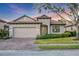 Charming single-story home featuring a brick driveway, well-maintained landscaping, and a neutral color palette at 3715 80Th E Dr, Sarasota, FL 34243