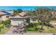 Lovely home with a brick driveway, lush lawn, and a well-maintained exterior at 3715 80Th E Dr, Sarasota, FL 34243