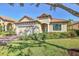 Inviting single-Gathering home with a manicured lawn, brick driveway, and a well-maintained facade at 3715 80Th E Dr, Sarasota, FL 34243