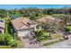 Beautiful home with a brick driveway, manicured lawn, and lush landscaping at 3715 80Th E Dr, Sarasota, FL 34243