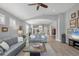 Open concept living room featuring wood floors, comfortable seating, and an open layout at 3715 80Th E Dr, Sarasota, FL 34243