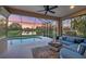 Screened lanai offering a relaxing seating area and private pool overlooking a serene pond at 3715 80Th E Dr, Sarasota, FL 34243