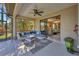 Screened-in patio with comfortable seating and a view of the outdoor landscape at 3715 80Th E Dr, Sarasota, FL 34243