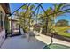 Backyard featuring a screened-in pool and patio area, perfect for outdoor gatherings and relaxation at 3715 80Th E Dr, Sarasota, FL 34243