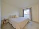 Simple bedroom with natural light from a window and minimalist decor at 4015 11Th W Ave, Bradenton, FL 34205