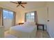 Well lit bedroom features two windows and ceiling fan at 4015 11Th W Ave, Bradenton, FL 34205