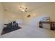 Spacious bonus room with ceiling fan, large closet, and bright white walls and room for activities at 4015 11Th W Ave, Bradenton, FL 34205