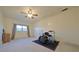 Spacious bonus room with ceiling fan, large closet, and bright white walls and room for activities at 4015 11Th W Ave, Bradenton, FL 34205
