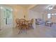 Cozy dining area next to a cozy living room with a ceiling fan and a comfortable sofa at 4015 11Th W Ave, Bradenton, FL 34205