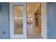 View through the sliding doors to a dining area, living room, and kitchen at 4015 11Th W Ave, Bradenton, FL 34205