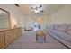 Inviting living room with a ceiling fan and a cozy seating area featuring a comfortable sofa at 4015 11Th W Ave, Bradenton, FL 34205