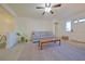 Bright living room with open layout, ceiling fan, and comfortable sofa, creating a welcoming atmosphere at 4015 11Th W Ave, Bradenton, FL 34205