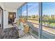 Enclosed balcony providing serene views of the well-maintained green space at 4240 Ironwood Cir # 302A, Bradenton, FL 34209