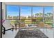 This screened-in balcony with golf course views offers a cozy spot to relax or entertain at 4240 Ironwood Cir # 302A, Bradenton, FL 34209