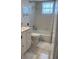 Bright bathroom featuring a shower-tub combo and a modern vanity with storage at 4240 Ironwood Cir # 302A, Bradenton, FL 34209