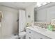 Bathroom with a walk-in shower and a vanity with a stone countertop at 4240 Ironwood Cir # 302A, Bradenton, FL 34209