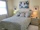 Charming bedroom with a comfortable bed, decorative pillows, and ample natural light at 4240 Ironwood Cir # 302A, Bradenton, FL 34209
