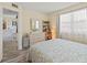 Bright bedroom featuring a dresser with mirror, blanket chest and ladder bookcase at 4240 Ironwood Cir # 302A, Bradenton, FL 34209