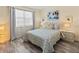 Comfortable bedroom with neutral decor, ample natural light, and wood-look floors at 4240 Ironwood Cir # 302A, Bradenton, FL 34209