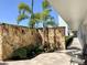 Beautiful courtyard area with stone wall, mature landscaping and access to the building at 4240 Ironwood Cir # 302A, Bradenton, FL 34209