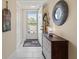 Inviting entryway with tile floors, decorative mirror, and stylish cabinet at 4240 Ironwood Cir # 302A, Bradenton, FL 34209