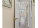 Hallway view leading to a bedroom with wood floors and natural light at 4240 Ironwood Cir # 302A, Bradenton, FL 34209