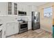 Bright kitchen boasts stainless steel appliances, stylish countertops, and white cabinets for a clean design at 4240 Ironwood Cir # 302A, Bradenton, FL 34209