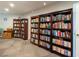 Community library with floor-to-ceiling bookshelves, comfortable seating, and ample reading material at 4240 Ironwood Cir # 302A, Bradenton, FL 34209