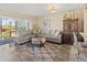 Cozy living room with comfortable seating, neutral colors, and wood flooring at 4240 Ironwood Cir # 302A, Bradenton, FL 34209