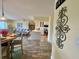 Open-concept living space with a kitchen, dining area, and living room featuring stylish decor and wood floors at 4240 Ironwood Cir # 302A, Bradenton, FL 34209