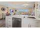 Open living area showcasing kitchen with stainless appliances and view of the living room at 4240 Ironwood Cir # 302A, Bradenton, FL 34209
