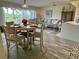 Bright and open living room area with dining space and view to the kitchen featuring comfortable seating and modern decor at 4240 Ironwood Cir # 302A, Bradenton, FL 34209