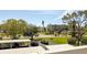 View of the parking lot and a building with lush landscaping around at 4240 Ironwood Cir # 302A, Bradenton, FL 34209