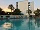 Enjoy the sparkling pool, plenty of poolside seating, lush palms, and beautiful landscaping at 4240 Ironwood Cir # 302A, Bradenton, FL 34209