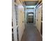 Storage room featuring lockers, a shelving unit, and a concrete floor at 4240 Ironwood Cir # 302A, Bradenton, FL 34209