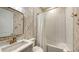 This bathroom features classic subway tile, a stylish vanity, and decorative wallpaper at 4717 Zeno Ct, Bradenton, FL 34211