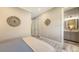 This bedroom is designed with comfortable bed and includes a decorative wall hanging at 4717 Zeno Ct, Bradenton, FL 34211