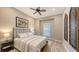 This charming bedroom features a neutral color palette, complemented by wood-look floors and modern ceiling fan at 4717 Zeno Ct, Bradenton, FL 34211