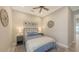 Cozy bedroom features a comfortable bed, ceiling fan, and neutral decor, creating a serene atmosphere at 4717 Zeno Ct, Bradenton, FL 34211