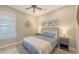 Cozy bedroom featuring a comfortable bed, ceiling fan, and neutral decor, creating a serene atmosphere at 4717 Zeno Ct, Bradenton, FL 34211