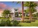 Gated community entrance featuring palm trees and lush landscaping, providing a secure and welcoming entry at 4717 Zeno Ct, Bradenton, FL 34211