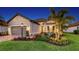 Charming single-story home features a well-manicured lawn, beautiful landscaping, and a two-car garage at 4717 Zeno Ct, Bradenton, FL 34211