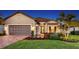 Charming single-story home features a well-manicured lawn, beautiful landscaping, and a two-car garage at 4717 Zeno Ct, Bradenton, FL 34211