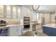 Well-appointed kitchen featuring stainless steel appliances, custom cabinets, and a tile backsplash at 4717 Zeno Ct, Bradenton, FL 34211