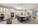 Modern kitchen featuring a large island, pendant lighting, and stainless-steel appliances at 4717 Zeno Ct, Bradenton, FL 34211