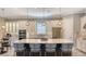 Stylish kitchen featuring a large center island, stainless steel appliances, modern fixtures, and custom backsplash at 4717 Zeno Ct, Bradenton, FL 34211